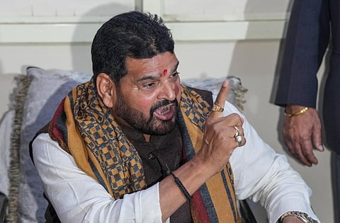 BJP MP Brij Bhushan Sharan Singh addresses the media after the Sports Ministry suspended the newly-elected Wrestling Federation of India body for not following rules. (Photo | PTI)