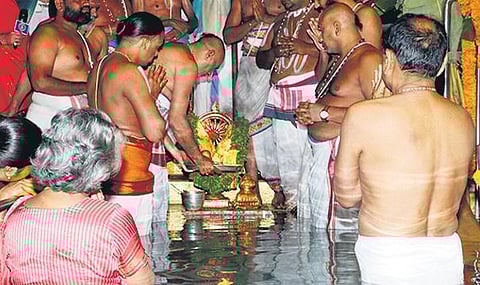 Priests perform Chakra Snanam in connection with Swamy Pushkarini Theertha Mukkoti at Tirumala on Sunday I express