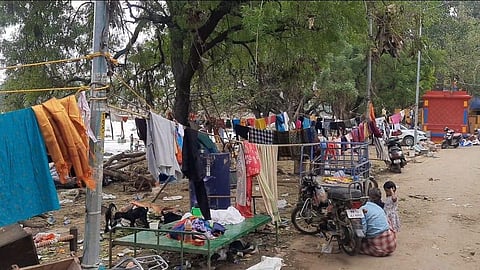 Residents of Sindupoonthurai drying their cloths and keeping their household items in the riverbank (Photo | Express)