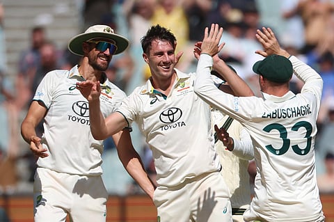 Australia's Pat Cummins celebrates the wicket of Pakistan's Abdullah Shafique during the second day of their cricket test match in Melbourne on Wednesday, December 27, 2023. (Photo | AP)