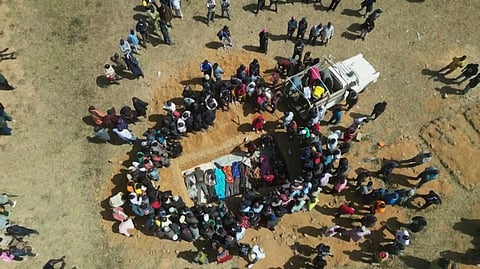 AFPTV video grab taken in Maiyanga village, Bokkos on Dec 27, 2023, shows families burying in a mass grave their relatives killed in deadly attacks conducted by armed groups in central Nigeria | AFP