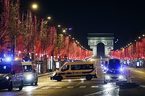 Police vans are parked on the Champs Elysees avenue during the New Year's Eve, in Paris, Thursday, Dec. 31, 2020. (Photo | AP)