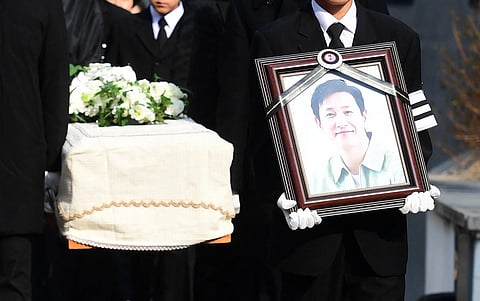 Mourners carry a portrait and the casket containing late South Korean actor Lee Sun-kyun after his funeral ceremony at the Seoul National University Hospital in Seoul. (Photo | AFP)
