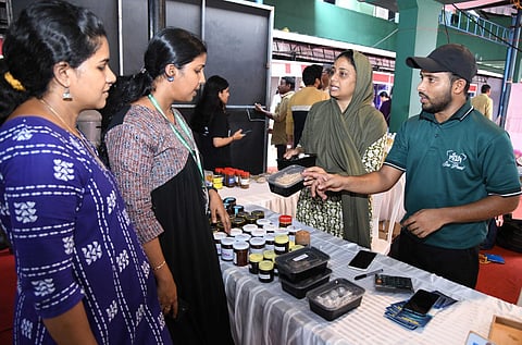 Visitors throng Lakshadweep stall to taste seaweed halwa at Fish-Millet food festival organised by CMFRI in Kochi. (Express)