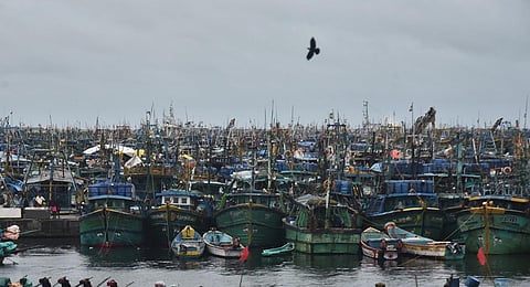 IMD advised the fishermen not to venture into sea for fishing at Kasimedu on Saturday while  Cyclone Michaung expected to hit Chennai coast - Express / P Jawahar