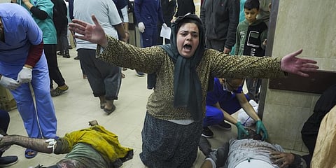 Palestinians wounded in the Israeli bombardment of the Gaza Strip are brought to the hospital in Deir al Balah on Sunday, Dec. 3, 2023. (AP Photo)