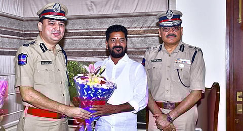 Telangana Congress President A Revanth Reddy with Telangana DGP Anjani Kumar(right)  and Additional DG Sanjay Kumar Jain during a meeting, in Hyderabad, Sunday, Dec. 3, 2023. (PTI Photo)