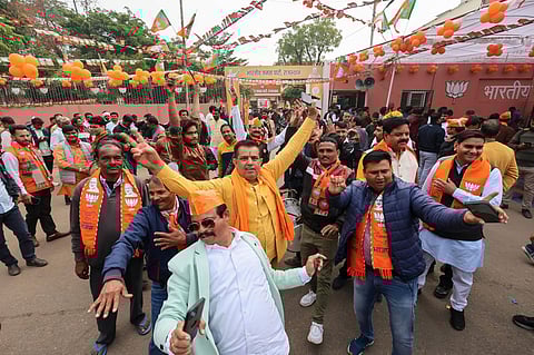 BJP workers and supporters celebrate outside the party headquarters in Jaipur during counting of votes for the Rajasthan Assembly elections (Photo | PTI)