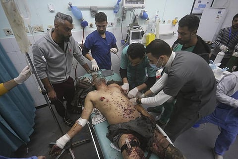 A Palestinian wounded in the Israeli bombardment of the Gaza Strip is treated in a hospital in Rafah, Saturday, Dec. 30, 2023. (Photo | AP)