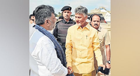 Karnataka DyCM DK Shivakumar greets TDP supremo and former Andhra Pradesh CM N Chandrababu Naidu at HAL Airport in Bengaluru on Thursday. (Photo | Express)