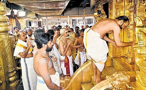 Sabarimala melsanthi P N Mahesh Namboothiri opening the sreekovil of Sabarimala temple on Saturday for Makaravilakku season | Shaji Vettipuram