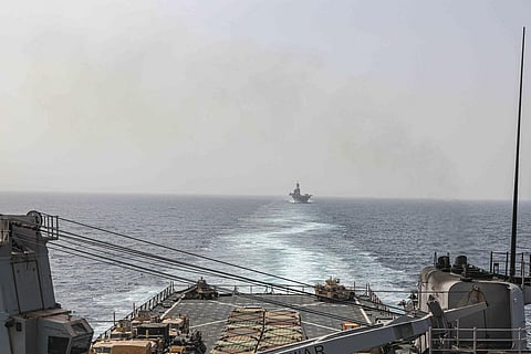 The amphibious dock landing ship USS Carter Hall and amphibious assault ship USS Bataan transit the Bab al-Mandeb strait on Aug. 9, 2023. | AP