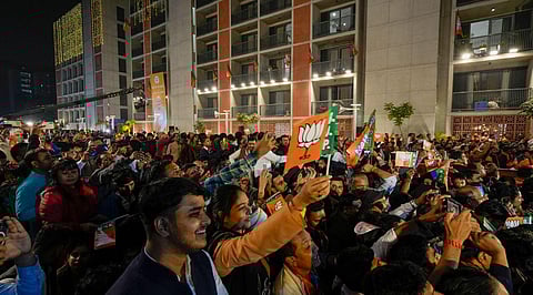 BJP workers celebrate after party's victory in elections to the Legislative Assemblies of Madhya Pradesh, Rajasthan and Chhattisgarh, at BJP headquarters, in New Delhi, Dec. 3, 2023. (PTI Photo)