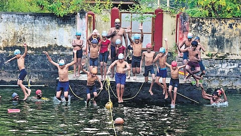A swimming coaching session by S P Muraleedharan at Sreekrishna Swami Temple pond, Pallippuram, in Kochi | A Sanesh