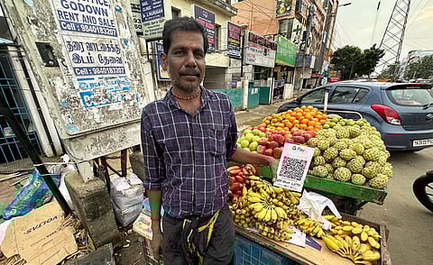 P Prakash, a fruit seller in Nolambur says he has not faced any disruptions in the UPI payments since Tuesday.  (Photo| Sunish P Surendran, EPS)