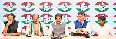 Congress MP Uttam Kumar Reddy (left) appears to be in deep thought as AICC general secretary KC Venugopal addresses  the media in New Delhi on Tuesday