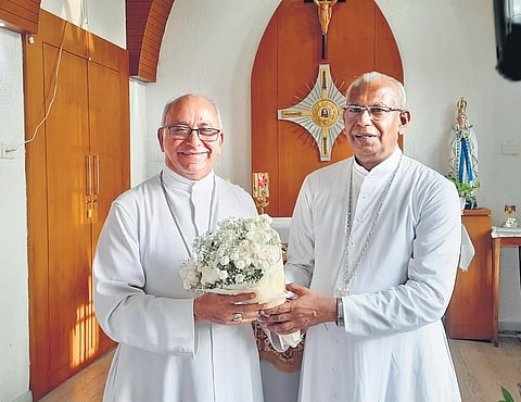 Archbishop Mar Andrews Thazhath (R) welcomes Bishop Bosco Puthur, who took charge as the new Apostolic Administrator of the Ernakulam-Angamaly Archdiocese