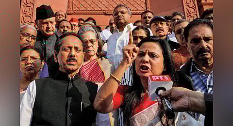 TMC leader Mahua Moitra addresses the media with Congress MP Sonia Gandhi and other opposition leaders after her expulsion from the Lok Sabha, in New Delhi, Friday, Dec. 8, 2023. (PTI Photo)