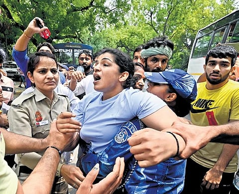 File photo of Bajrang Punia, Sakshi Malik and Vinesh Phogat in a protest in Delhi. (Photo | EPS)