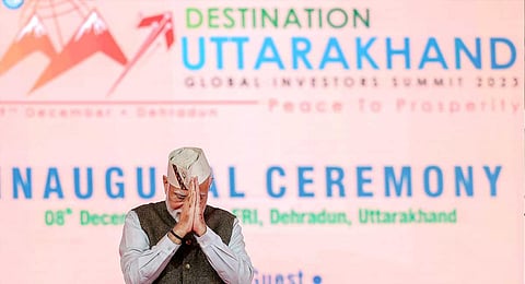 Prime Minister Narendra Modi greets the gathering during the inauguration of 'Uttarakhand Global Investors Summit 2023', in Dehradun, Friday, Dec. 8, 2023. (PTI)