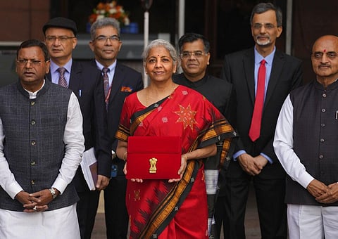 Finance Minister Nirmala Sitharaman poses for the media before presenting the Union Budget for the financial year 2023-24 in the Parliament in New Delhi, Feb. 1, 2023. (Photo | AP)