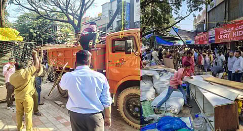 BBMP workers clear illegal shops near the Jayanagar Complex on Wednesday. (Photo | Express)