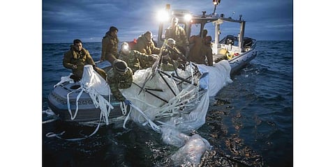 US Navy sailors recover the high-altitude Chinese surveillance balloon off the coast of Myrtle Beach, South Carolina, in the Atlantic Ocean, Feb 5, 2023. (Photo | AFP)