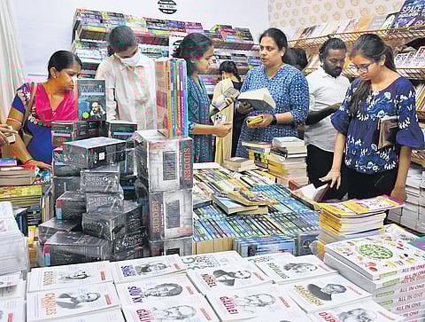 People taking a look at the books exhibited during the 33rd edition of Vijayawada book fest at Polytechnic college ground on Friday | Prasant Madugula