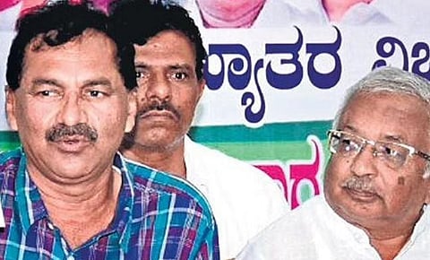 KPCC spokesperson M Lakshman (left)