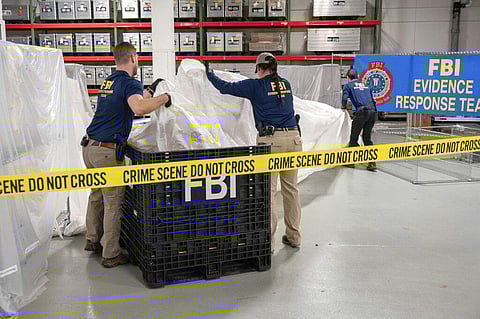 FBI special agents assigned to the evidence response team process material recovered from the high altitude balloon recovered off the coast of South Carolina, Feb. 9, 2023. (Photo | AP)