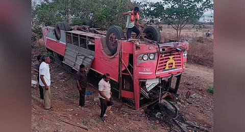 The bus driver lost control of the bus and the vehicle turned turtle by the side of the road. (Photo | Express)