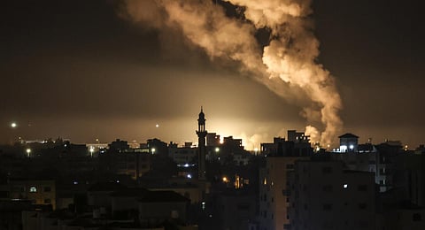 Fire and smoke rise above buildings in Gaza City as Israel launched air strikes on the Palestinian enclave. (Photo | AFP)