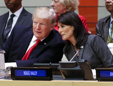 Donald Trump speaks with Nikki Haley before a meeting during the United Nations General Assembly at U.N. headquarters, Sept. 18, 2017. (File Photo | AP)