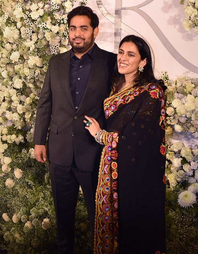 Industrialist Akash Ambani poses for photos with his wife Shloka Mehta at the wedding reception of Sidharth Malhotra and Kiara Advani in Mumbai. (Photo | PTI)