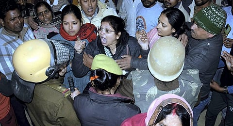 Villagers in a scuffle with police officers after mother and daughter were reportedly burnt alive during an anti-encroachment drive, in Kanpur Dehat. (Photo | PTI)