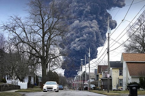 A black plume rises over East Palestine, Ohio, as a result of a controlled detonation of a portion of the derailed Norfolk Southern trains Monday, Feb. 6, 2023.  (Photo | AP)