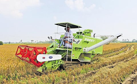 A harvester reaping crops near Nagapattinam | express