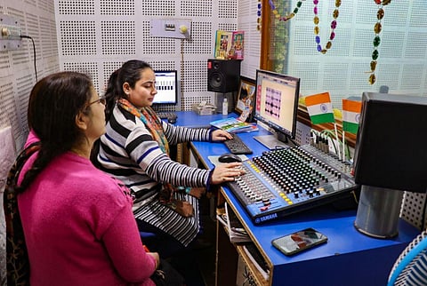 People from the Kashmiri Pandit community at a community radio station, 'Radio Sharda' 90.4 FM, in Jammu. (Photo | PTI)