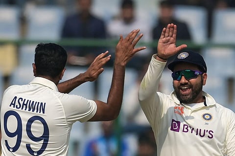 India's captain Rohit Sharma celebrates with Ravichandran Ashwin after the dismissal of Australia's Alex Carey during the first day of the second Test cricket match. (Photo | AFP)