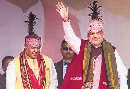 Amit Shah at a public rally ahead of Meghalaya Assembly elections at Dalu in West Garo Hills district on Friday. Assam CM Himanta Biswa Sarma is also seen. (Photo | PTI)