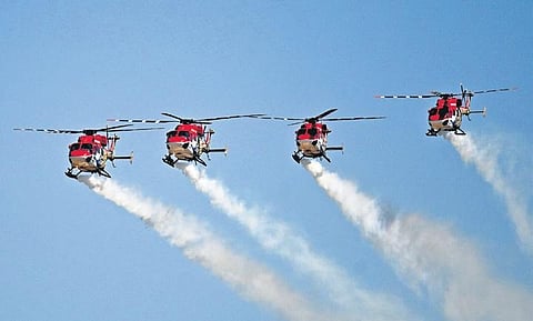 IAF’s Sarang helicopter aerobatic team performs on the last day of Aero India 2023, at Air Force Station, Yelahanka, in Bengaluru on Friday | Shashidhar Byrappa