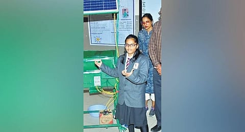 Subhashree Sahu poses with her much appreciated multi-function eco-friendly agro machine.