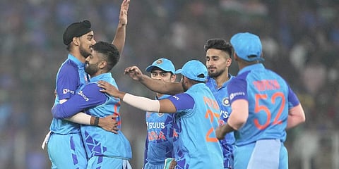 India's Arshdeep Singh with his teammates celebrates the wicket of New Zeland's Devon Conway during the third T20 cricket match. (Photo | PTI)