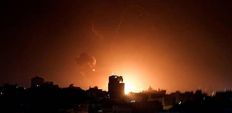 Fire and smoke rise above buildings in Gaza City as Israel launched air strikes on the Palestinian enclave. (Photo | AFP)