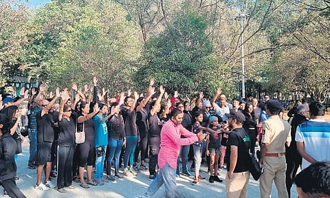 Residents, dressed in black, protest against construction of Sankey flyover