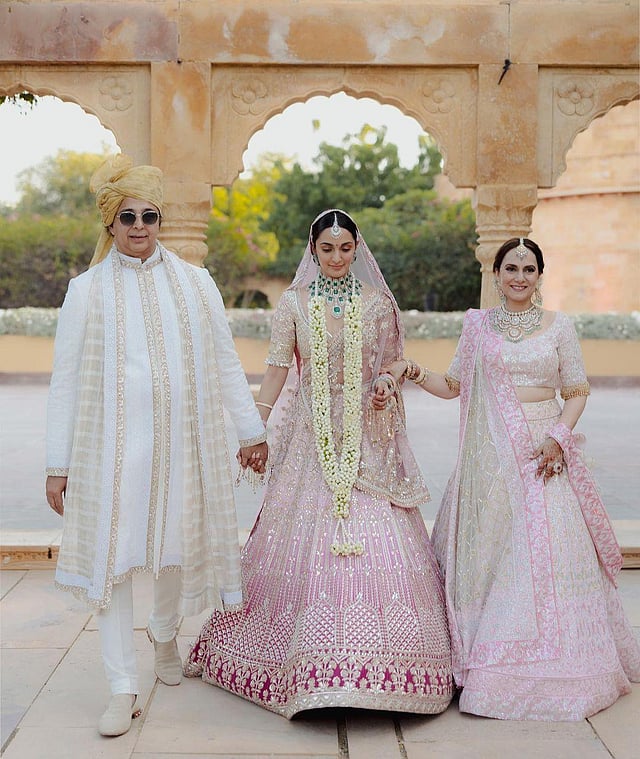 Designer Manish Malhotra captioned the photo thus: 'The mother and father (Jadeep Advani) of our elegant bride @kiaraaliaadvani in our complementing sorbet tinted custom couture. The matching ensembles encapsulate emotions of serenity and grace, dovetailing in complete harmony.' (Photo | Manish Malhotra Vows Instagram)