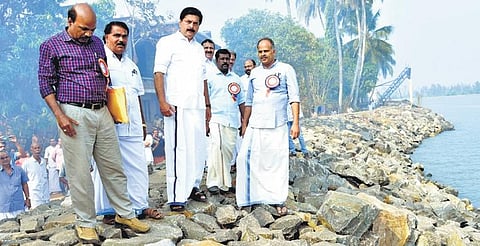 Water Resources Minister Roshy Augustine visits the reconstructed sea wall at Azheekkal coast in Kannur. MLA  K V Sumesh is also seen