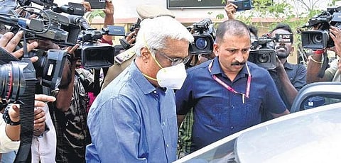 ED officials taking M Sivasankar back after producing him before the Special Court for Prevention of Money Laundering Act cases in Kochi on Monday | A Sane sh