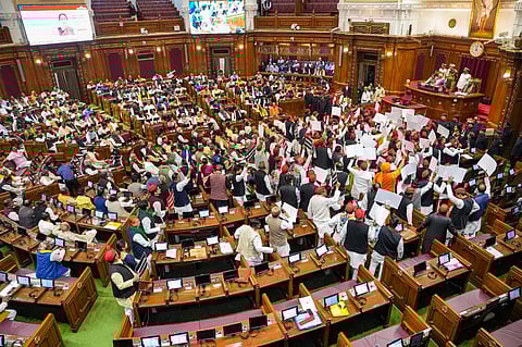 Samajwadi Party leaders protest during UP Governor Anandiben Patel's Budget session address at the Vidhan Bhawan in Lucknow, Feb. 20, 2023. (Photo | PTI)