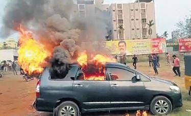 Car set on fire by YSRC workers at TDP office in Gannavaram on Monday | Express